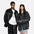 A male and female model in oversized black washed denim jackets, styled with casual streetwear outfits