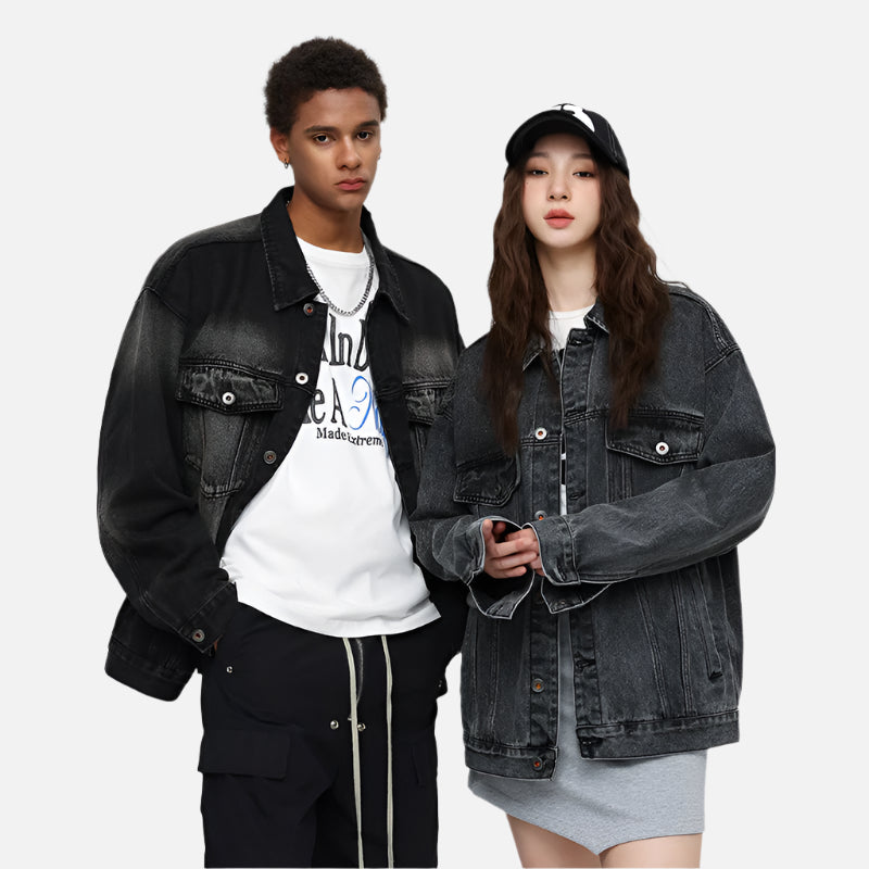 A male and female model in oversized black washed denim jackets, styled with casual streetwear outfits