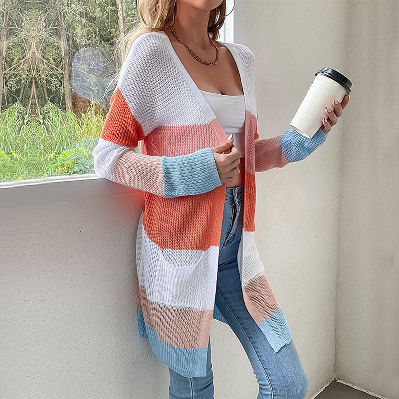 Color-block cardigan, white crop top, holding coffee, gold necklace
