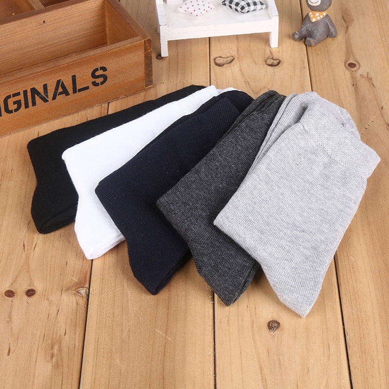 Assorted cotton crew socks in multiple neutral colors, showcasing versatile sock collection