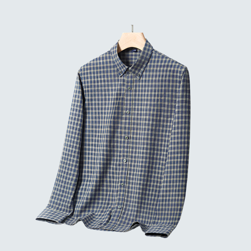 Blue and cream tattersall check shirt on wooden hanger. Classic country-style pattern in soft flannel