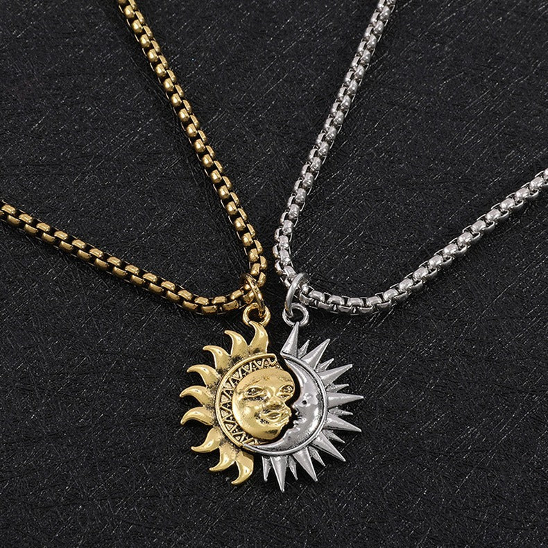 Gold and silver sun moon puzzle necklace set against dark background