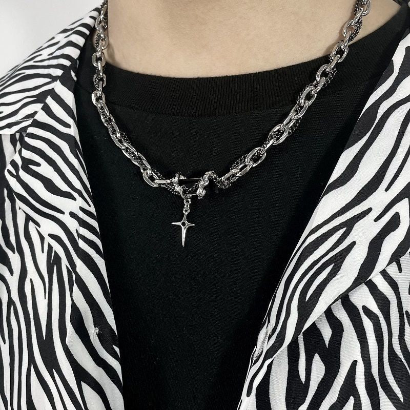 Silver chain necklace with star pendant worn with zebra print jacket