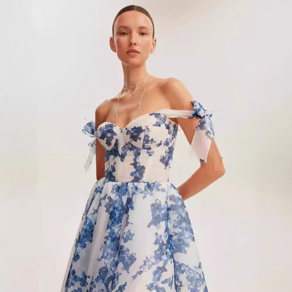 Off-shoulder blue and white floral organza dress with sweetheart neckline and voluminous midi skirt