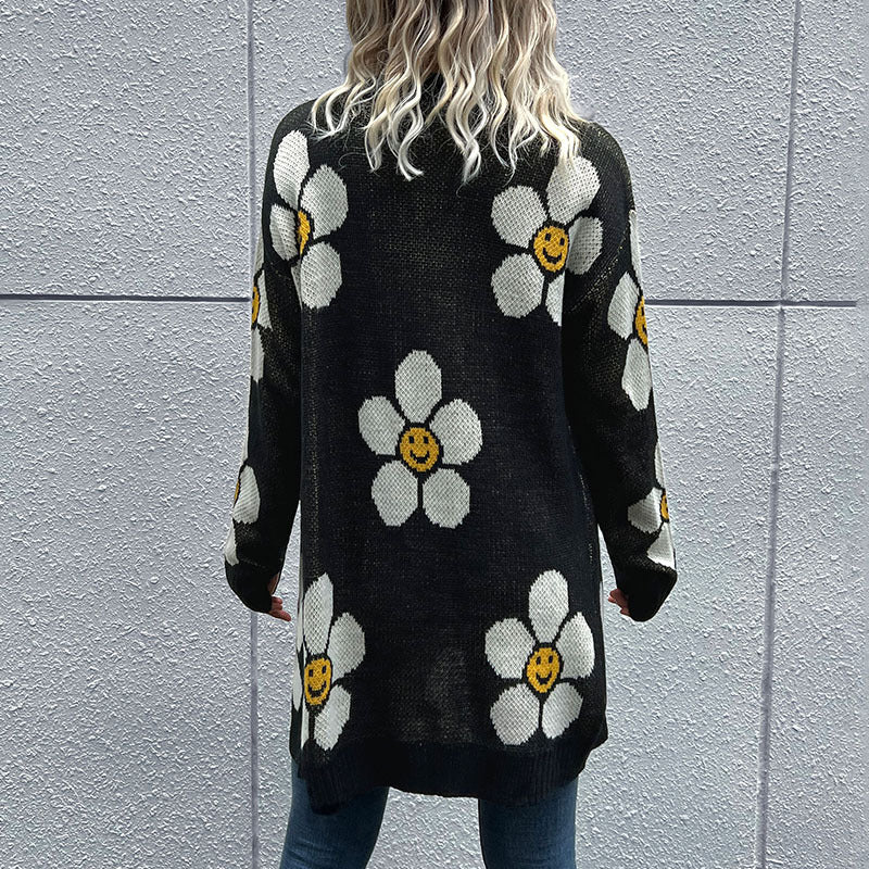Back view of black daisy-print cardigan with a relaxed fit
