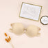 Nude beige strapless bra with gold-framed line art and wheat-like dried flowers