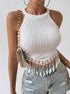 Front view of white halter crop top with crochet fringe hem and ribbed texture.