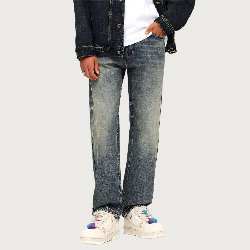 Wide leg vintage wash jeans styled with denim jacket and white platform sneakers with colorful accents