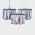 Three men's boxer briefs displayed on hangers, featuring floral, geometric, and text patterns in light blue and gray tones