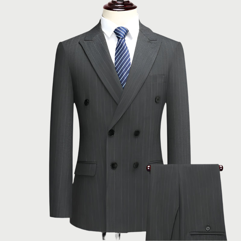 Charcoal gray double-breasted pinstripe suit with blue tie on mannequin, showing classic tailoring