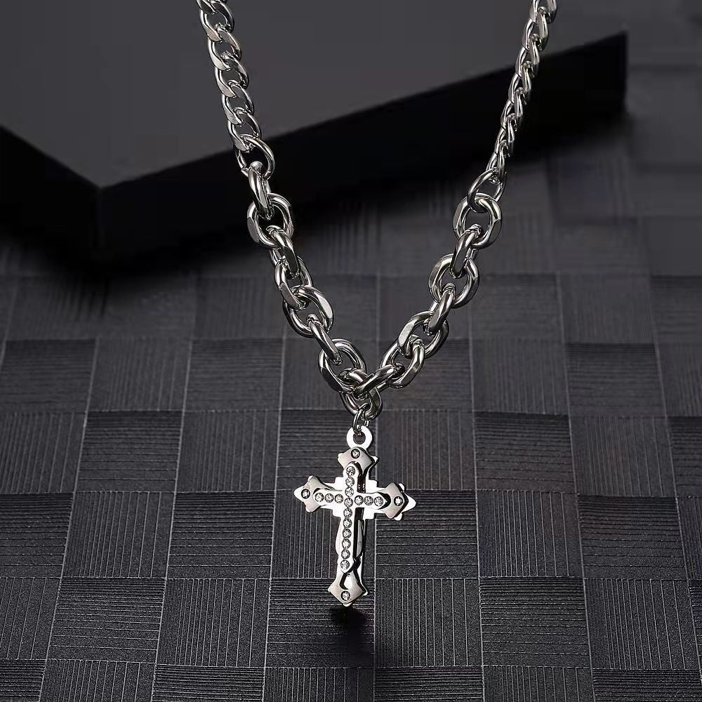 Silver chain necklace with rhinestone-studded cross pendant