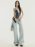 Front view, full-body shot with bag: Low-rise straight jeans in light denim, styled with chain belt.