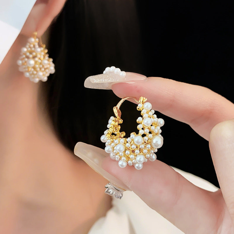 Elegant pearl cluster earrings with gold metalwork