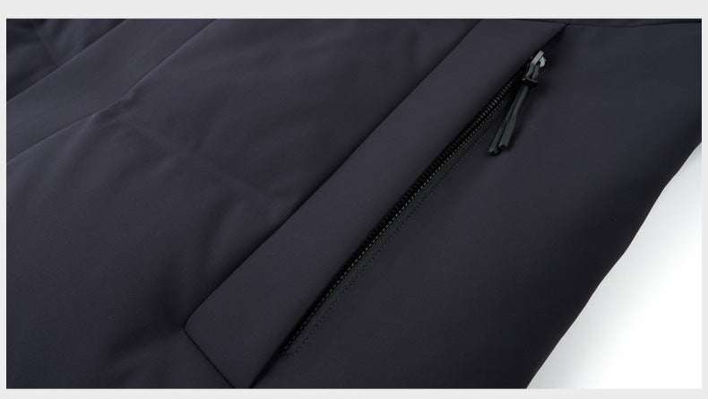 Black puffer coat with a sleek zippered pocket on the sleeve, designed for secure storage with a seamless, water-resistant finish