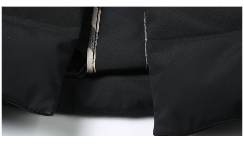 Detail of decorative trim edge with contrast piping along interior closure of coat