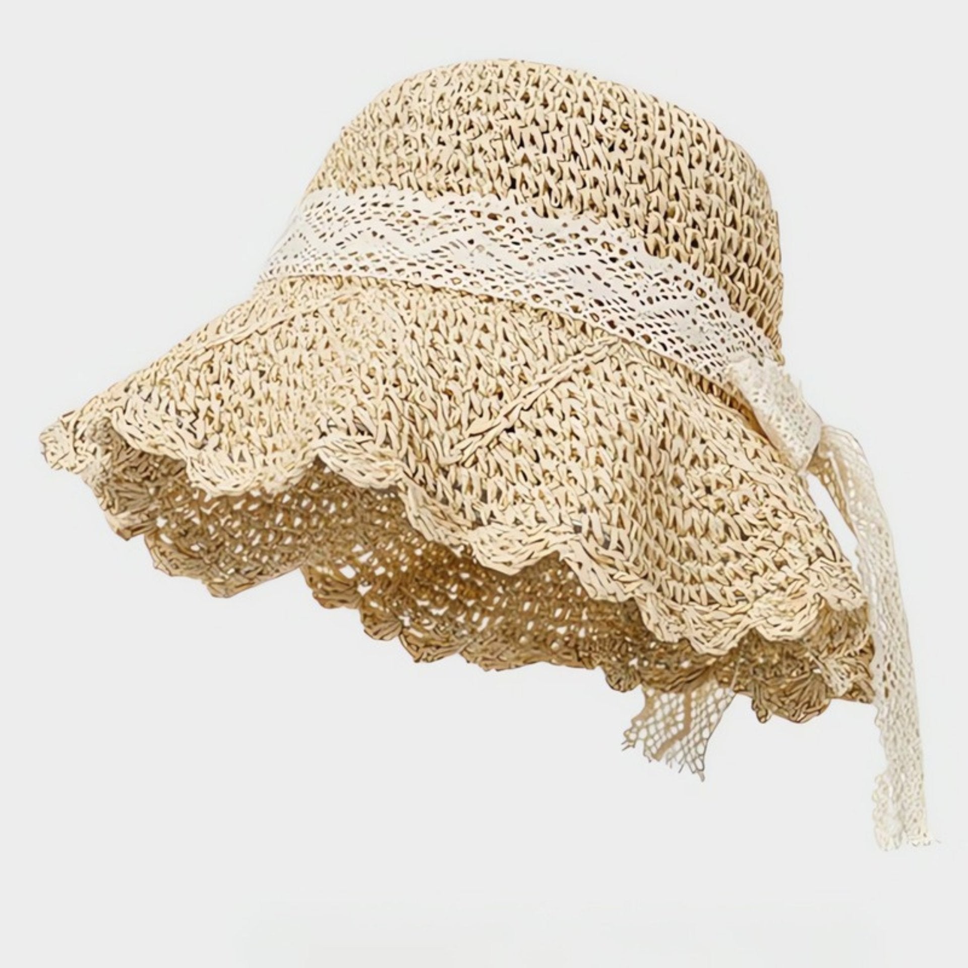 A beige straw sun hat with a ruffled brim and intricate lace detailing, complete with a romantic lace bow for a vintage touch.