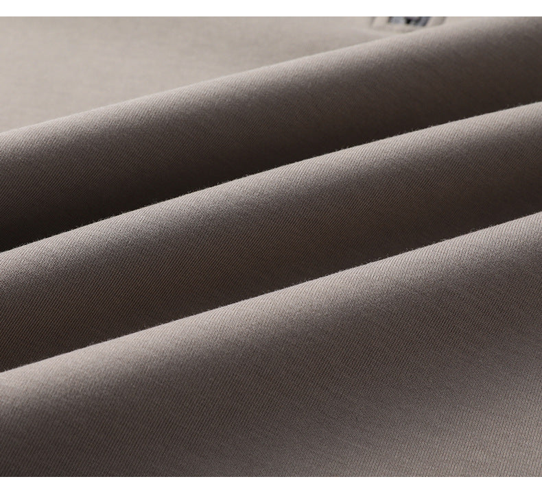 Macro texture shot of smooth gray cotton jersey fabric showing diagonal directional grain