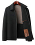 Dark gray wool jacket with stand collar slightly unzipped showing interior construction