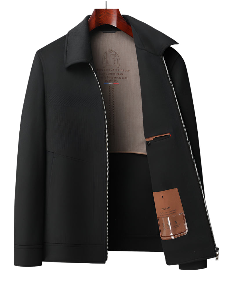 Dark gray wool jacket with stand collar slightly unzipped showing interior construction