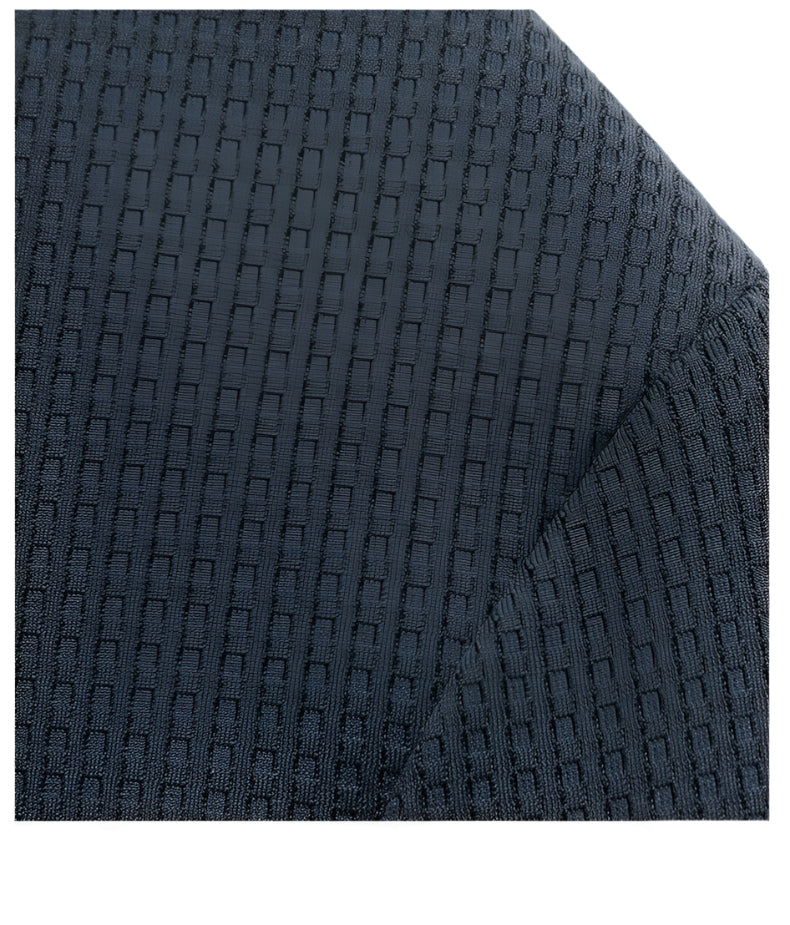 Detailed fabric texture of dark blue GFJFRIN blazer showing geometric basket-weave pattern across shoulder area