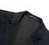 Close-up of navy blazer lapel and collar construction showing detailed interior lining