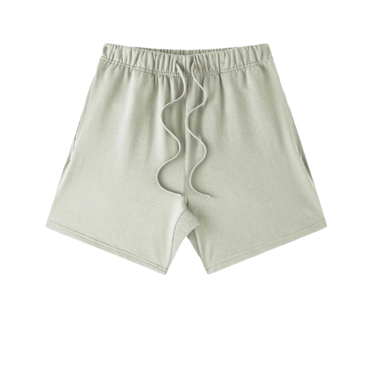 A light sage green pair of shorts with elastic waistband and drawstring displayed on a white background