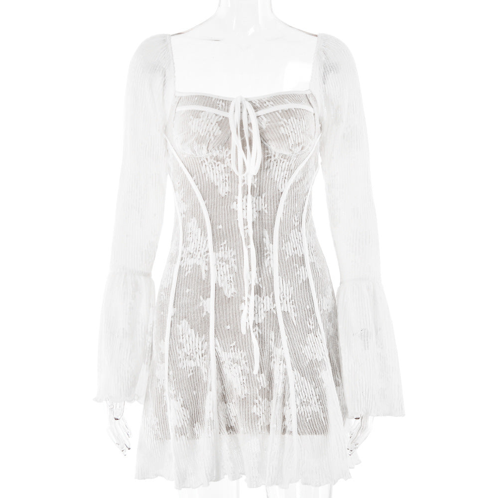 White lace mini dress with corset bodice and flared sleeves displayed on a mannequin against white background
