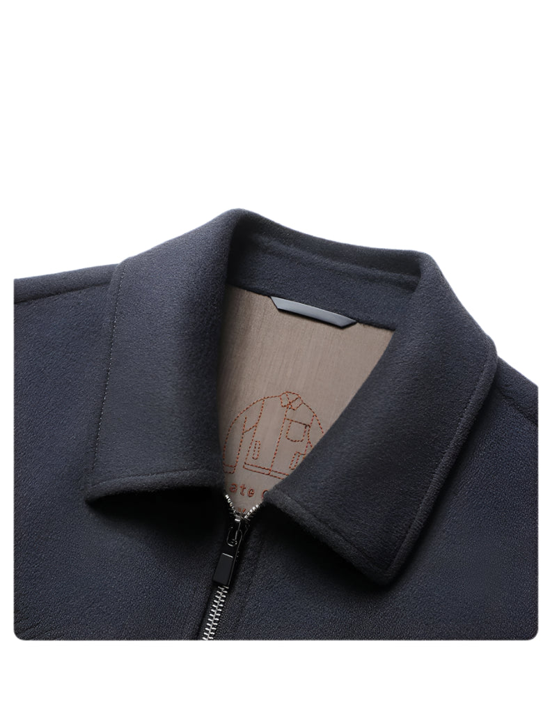 Close-up of dark gray wool jacket collar showing detailed stitching and lining