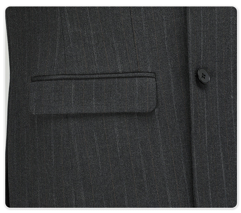 Detail of suit jacket pocket with pinstripe pattern alignment and precise tailoring
