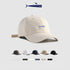 Beige baseball cap with blue embroidered fish logo and adjustable strap