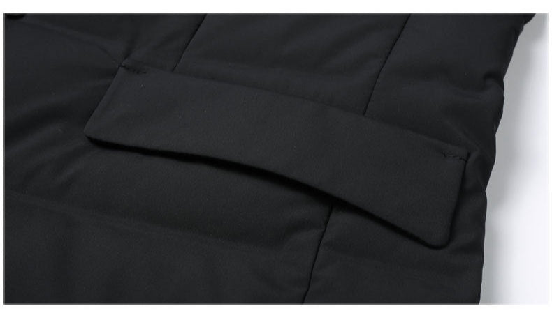 Close-up of coat hem construction showing clean finishing and reinforced edge detail