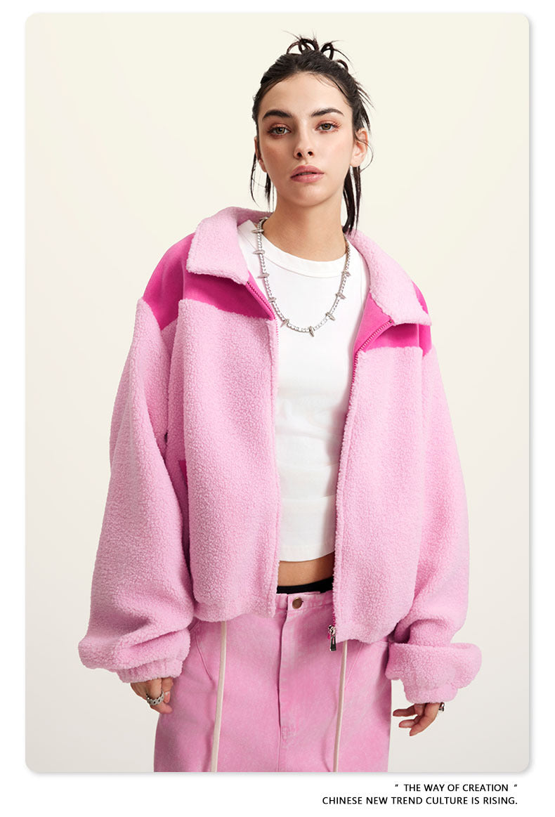 Pink fleece jacket with darker pink color-block shoulders and full zip