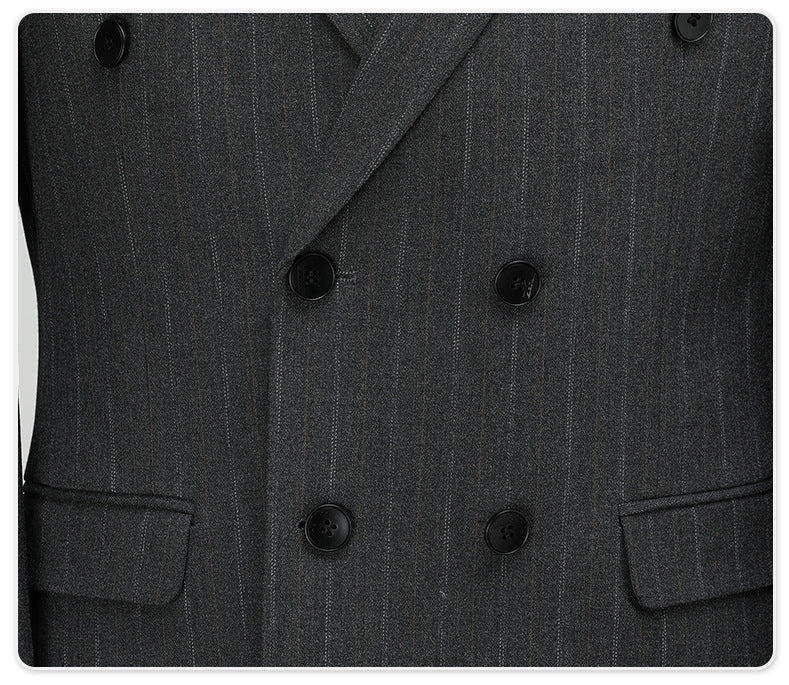 Close-up of double-breasted closure showing six-button configuration on dark pinstripe fabric