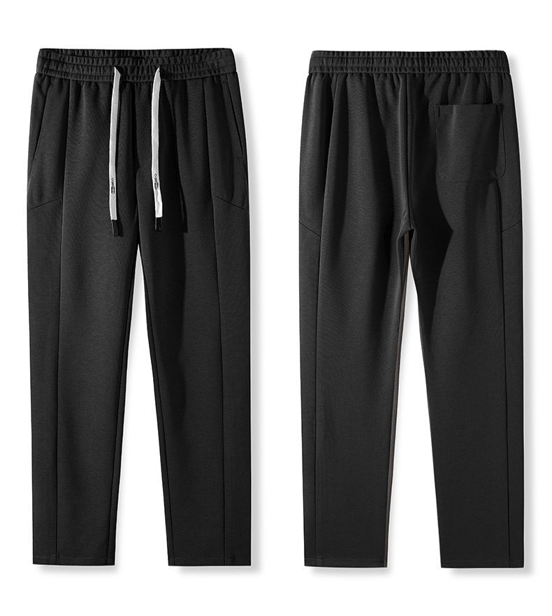 Close-up details of drawstring and waistband on black pants