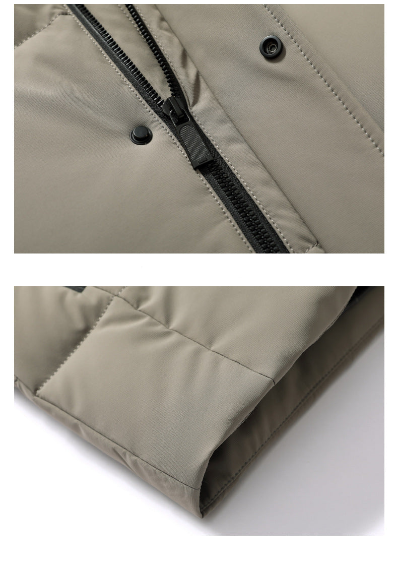 Close-up of light beige puffer jacket front closure showing black zipper, snap button placket and precision stitching details