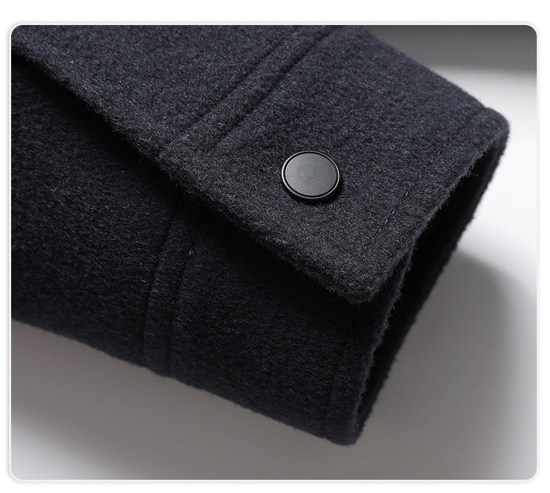Close-up of navy wool jacket sleeve with button detail on cuff
