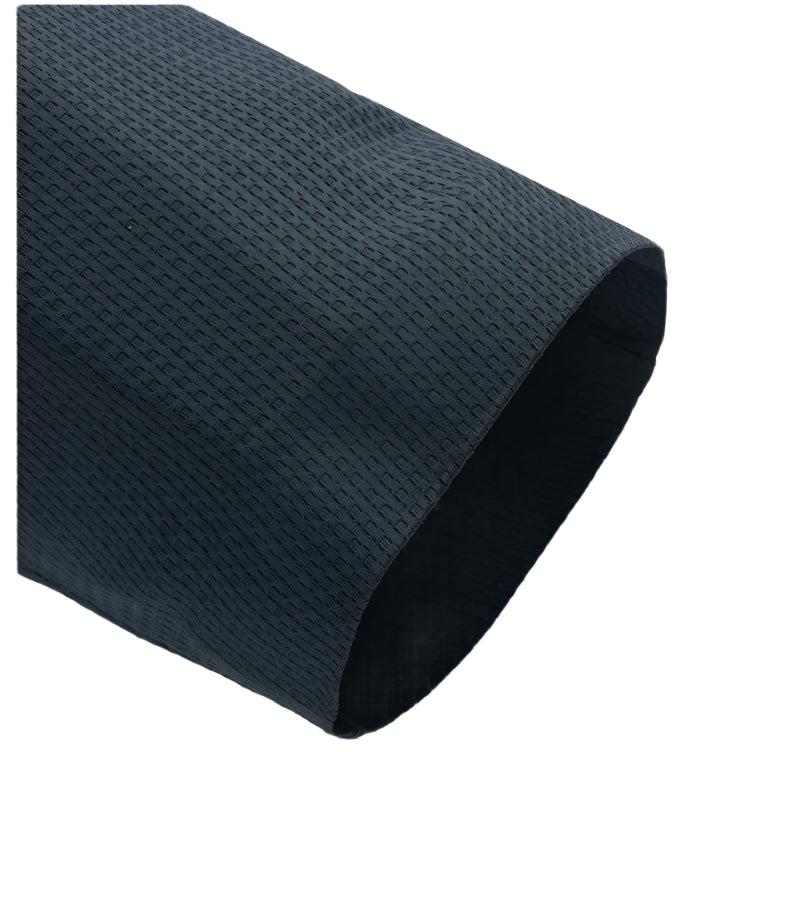 Detail shot of navy blazer's textured fabric edge, showing the depth and dimension of the material
