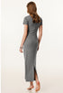 The back view of a female model wearing a light fray short-sleeved maxi dress, styled with silver jewelry for a chic look.