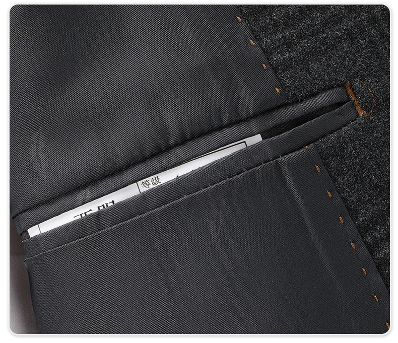 Interior jacket detail showing lining and label on charcoal wool suit