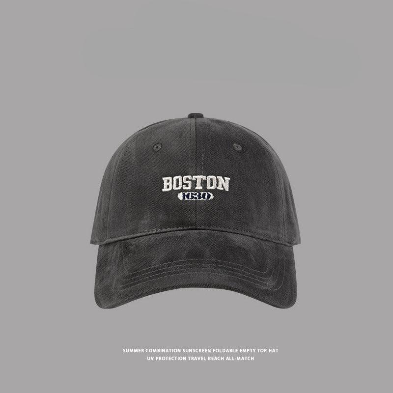 Gray Boston baseball cap with contrasting white embroidery, modern casual headwear