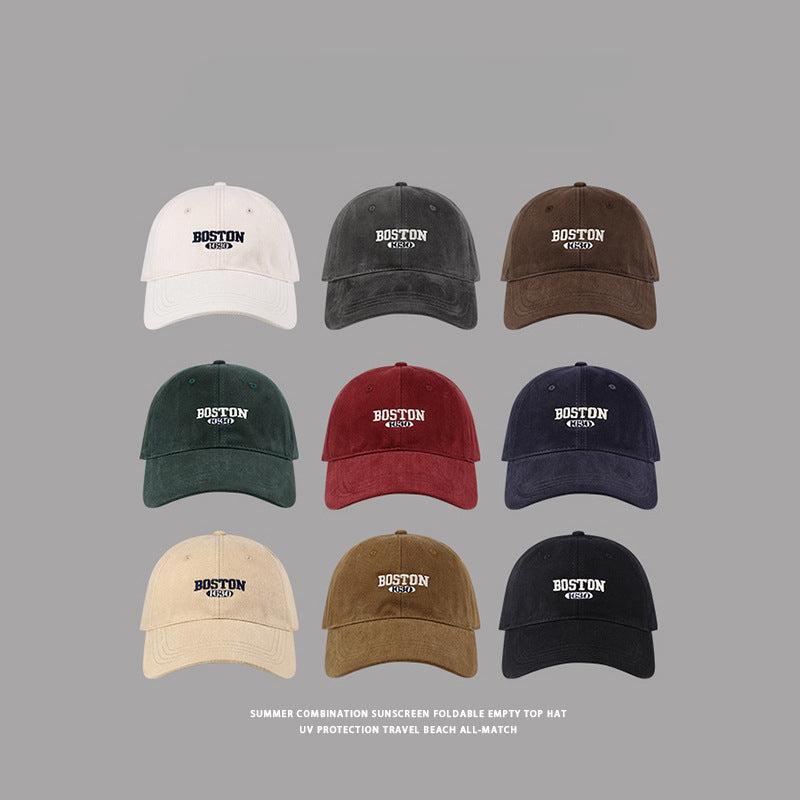 Collection of Boston 1630 baseball caps in nine colors, featuring classic embroidered design and adjustable fit