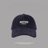 Navy blue Boston embroidered baseball cap with classic fit, UV protection beach hat against gray background