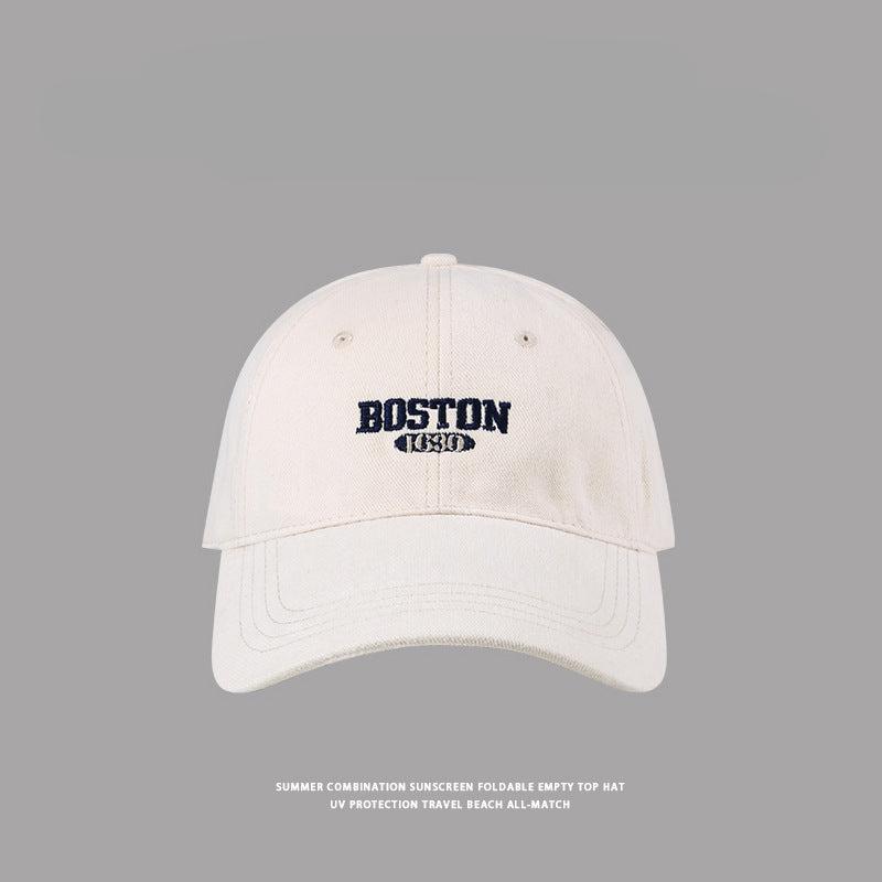 Beige Boston baseball cap with navy embroidered logo, classic summer UV protection headwear