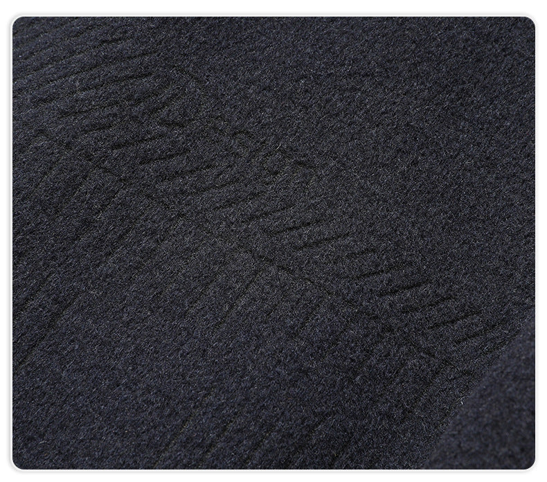 Close-up of navy wool fabric showing subtle textured pattern and soft finish