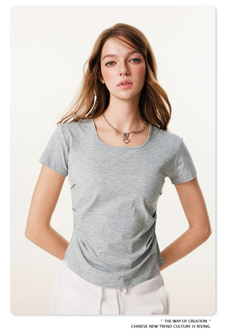 Gray heathered t-shirt showing scoop neckline and fitted silhouette