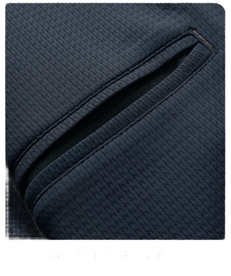 Close-up of tailored pocket detail on navy GFJFRIN blazer showing precise stitching and textured fabric construction