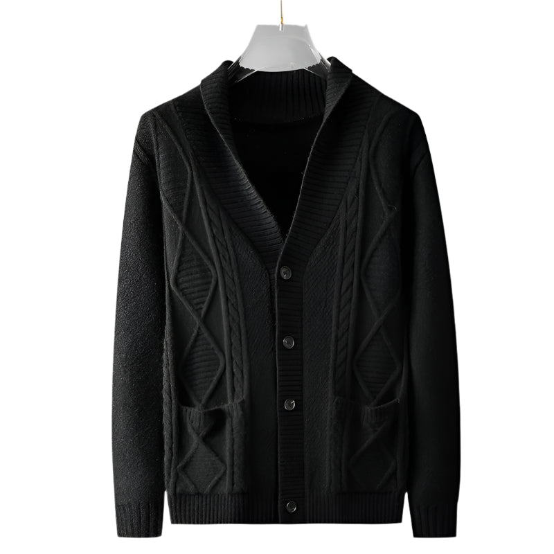 Black cable knit cardigan hanging on display with ribbed shawl collar, geometric knit pattern, and patch pockets clearly visible