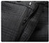 Close-up of trouser zipper and hook closure on charcoal plaid dress pants