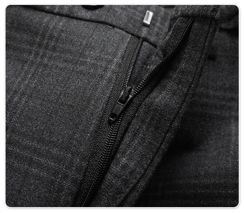 Close-up of trouser zipper and hook closure on charcoal plaid dress pants