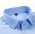 Close-up of light blue dress shirt collar detail showing quality stitching and size tag. Structured point collar visible